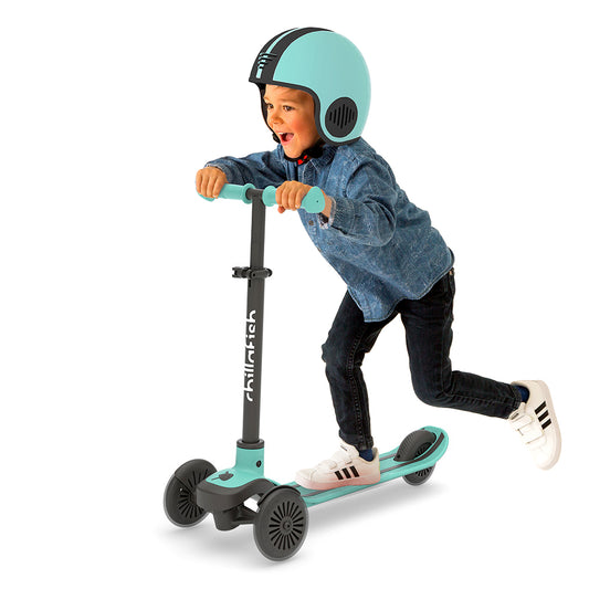 Trottinette 3 roues SCOTTI à incliner pour changer de direction, avec plateau antidérapant en forme de skateboard, frein arrière intégré, et guidon ajustable en hauteur, à partir de 3 ans